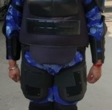 FEMALE SOLDIER WEARING FULL BODY PROTECTOR